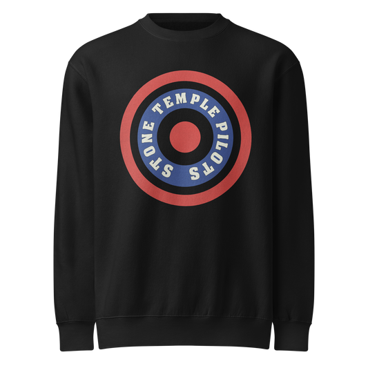 A black crewneck sweatshirt featuring a circular graphic on the chest with the text 'STONE TEMPLE PILOTS' in white on a blue ring, surrounded by a red ring and a red center.